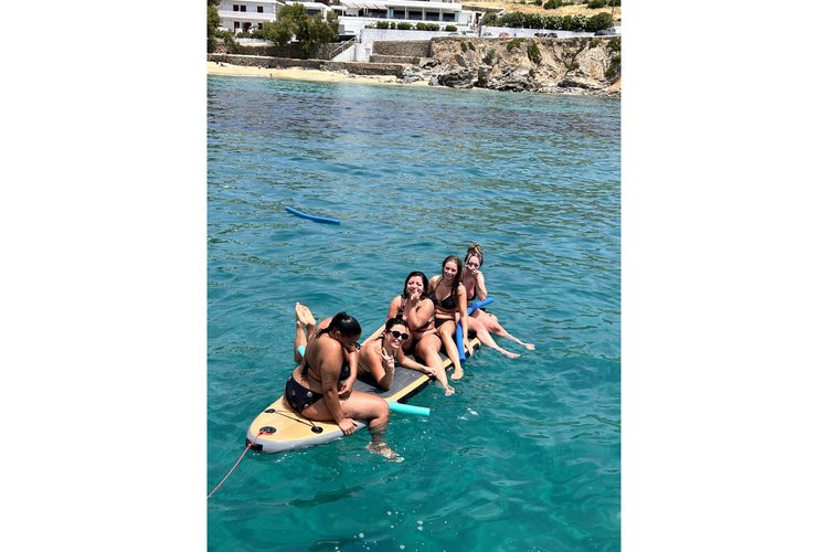 Discover Mykonos surroundings on this Wooden Traditional boat