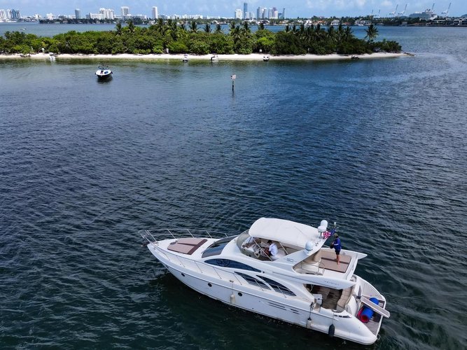 Discover Miami surroundings on this flybridge azimut boat