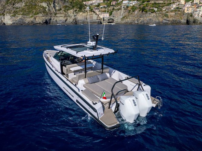 Experience Kalo Livadi, GR on board this amazing Axopar Boats Axopar 37  Sun Top