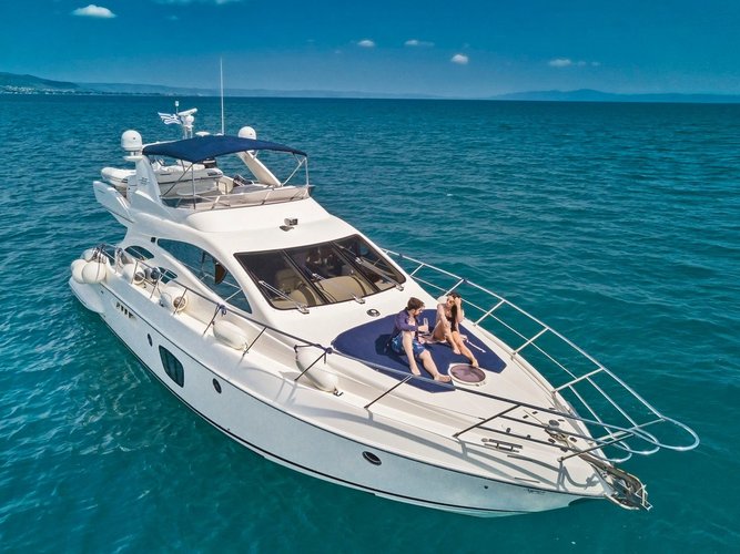 Experience Ornos on board this elegant motor boat